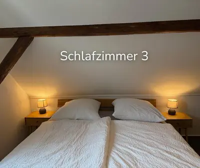 Ein Bett oder Betten in einem Zimmer der Unterkunft Zechenstube