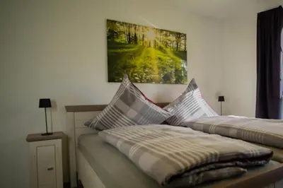 Ein Bett oder Betten in einem Zimmer der Unterkunft Ferienwohnung Busch 4