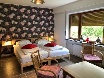 Ein Bett oder Betten in einem Zimmer der Unterkunft Gruppenhaus das Waldcafe