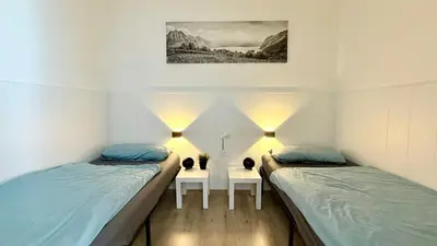 Ein Bett oder Betten in einem Zimmer der Unterkunft Family Lodge - familienfreundliches Appartement mit zwei Schlafzimmern im Ferienpark Hahnenklee