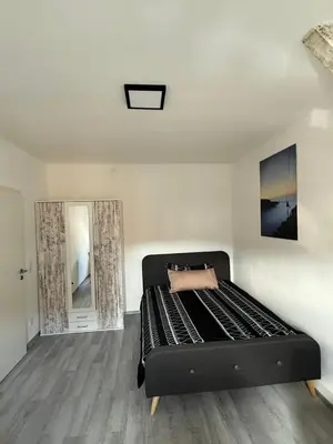Ein Bett oder Betten in einem Zimmer der Unterkunft Guestroom K17