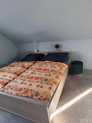 Ein Bett oder Betten in einem Zimmer der Unterkunft Ferienwohnung Hartmann