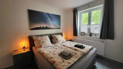 Ein Bett oder Betten in einem Zimmer der Unterkunft Heinrichs Ferienwohnungen Quedlinburg