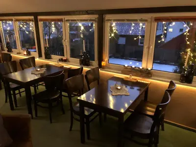 Ein Restaurant oder anderes Speiselokal in der Unterkunft Pension Mühlhahn