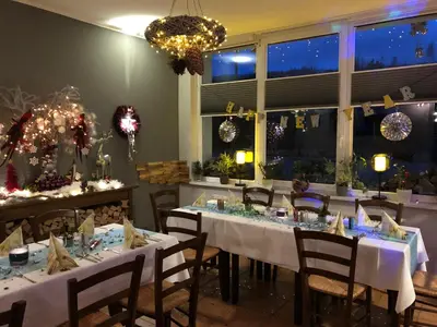 Ein Restaurant oder anderes Speiselokal in der Unterkunft Pension Mühlhahn