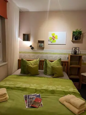 Ein Bett oder Betten in einem Zimmer der Unterkunft Pension Mühlhahn