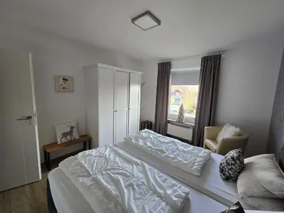 Ein Bett oder Betten in einem Zimmer der Unterkunft Ferienwohnung Am Hasselkopf 1