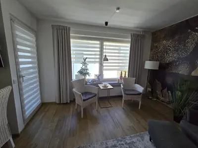 Ein Sitzbereich in der Unterkunft Ferienwohnung Am Hasselkopf 1