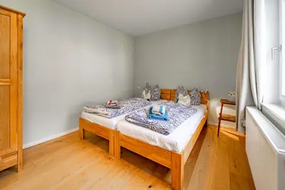 Ein Bett oder Betten in einem Zimmer der Unterkunft Forsthaus Wohnung 1 6 Pers Kamin & Waldluft