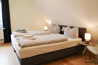 Ein Bett oder Betten in einem Zimmer der Unterkunft Forsthaus Wohnung 2 4 Pers Kamin & Balkon