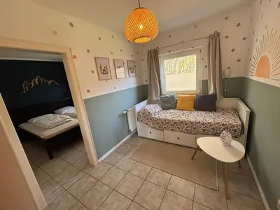 Ein Bett oder Betten in einem Zimmer der Unterkunft Das Eulennest