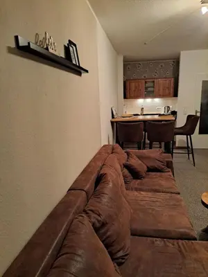 Ein Sitzbereich in der Unterkunft Ferienwohnung Pfeiffer groß