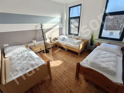 Ein Bett oder Betten in einem Zimmer der Unterkunft Harly-Resort