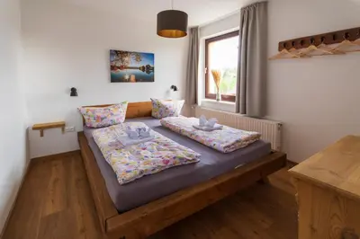 Ein Bett oder Betten in einem Zimmer der Unterkunft Ferienhaus Wolke 7