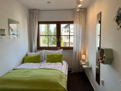 Ein Bett oder Betten in einem Zimmer der Unterkunft Ferienwohnung KaLü 4a