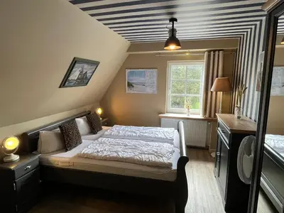 Ein Bett oder Betten in einem Zimmer der Unterkunft Ferienwohnung Oerdheks