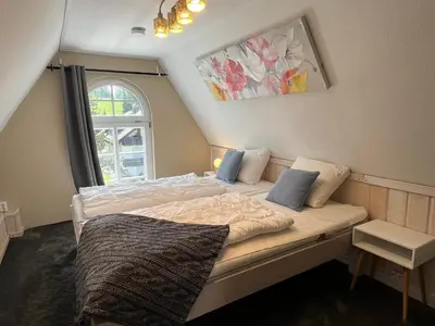 Ein Bett oder Betten in einem Zimmer der Unterkunft Ferienwohnung Oerdheks