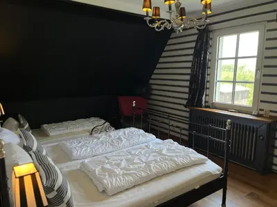 Ein Bett oder Betten in einem Zimmer der Unterkunft Ferienwohnung Hexenkessel in der Villa Brockenhexe