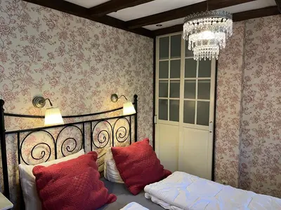 Ein Bett oder Betten in einem Zimmer der Unterkunft Ferienwohnung Waldhexe in der Villa Brockenhexe