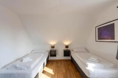 Ein Bett oder Betten in einem Zimmer der Unterkunft Ferienhaus BergZeit mit Garten, Grill, Terrasse, maximal 20 Personen