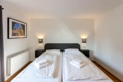 Ein Bett oder Betten in einem Zimmer der Unterkunft Ferienhaus BergZeit mit Garten, Grill, Terrasse, maximal 20 Personen
