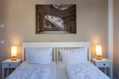 Ein Bett oder Betten in einem Zimmer der Unterkunft Ferienwohnung Morgenrot in der Villa Harzer Flair