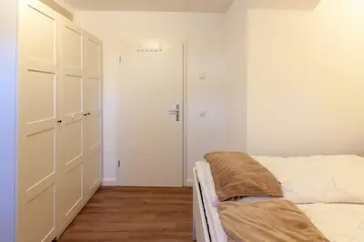 Ein Bett oder Betten in einem Zimmer der Unterkunft Ferienwohnung Mondschein in der Villa Harzer Flair