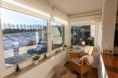 Ein Sitzbereich in der Unterkunft Ferienwohnung Sonnenschein in der Villa Harzer Flair
