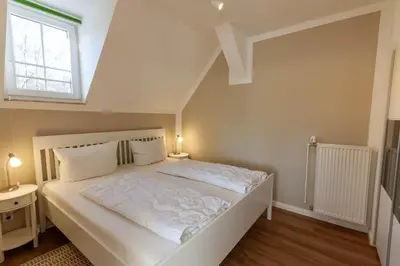 Ein Bett oder Betten in einem Zimmer der Unterkunft Ferienwohnung Sonnenschein in der Villa Harzer Flair