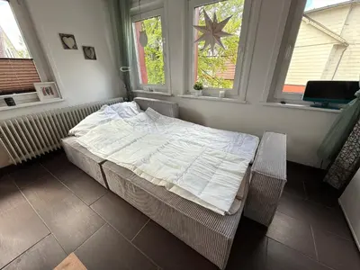 Ein Bett oder Betten in einem Zimmer der Unterkunft PrimeLoft Eule - bis 8 Pers - 2 Etagen - Balkon - modern & stilvoll - zentral in Braunlage