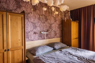 Ein Bett oder Betten in einem Zimmer der Unterkunft Muggel willkommen - Harz-Auszeit im Zauberquartier