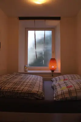 Ein Bett oder Betten in einem Zimmer der Unterkunft Ferienwohnung im Alten Peter
