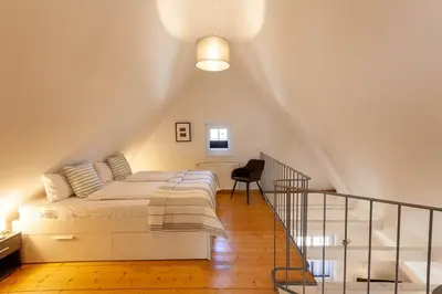 Ein Bett oder Betten in einem Zimmer der Unterkunft Maisonette-Ferienwohnung Hexennest