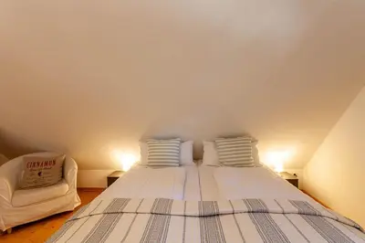 Ein Bett oder Betten in einem Zimmer der Unterkunft Maisonette-Ferienwohnung Hexennest