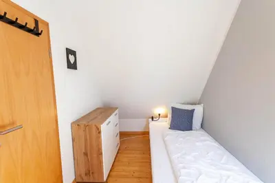 Ein Bett oder Betten in einem Zimmer der Unterkunft Maisonette-Ferienwohnung Hexennest