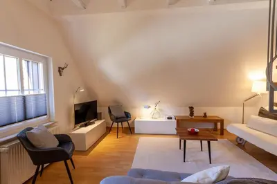 Ein Sitzbereich in der Unterkunft Maisonette-Ferienwohnung Hexennest