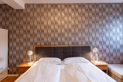 Ein Bett oder Betten in einem Zimmer der Unterkunft Ferienwohnung Herzog 1 mit Terrasse