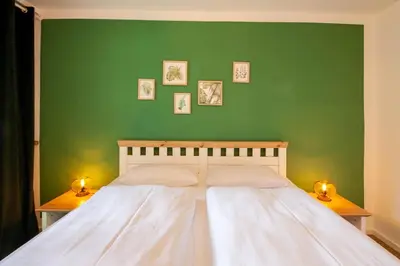 Ein Bett oder Betten in einem Zimmer der Unterkunft Ferienwohnung Am Bach 1 mit Terrasse