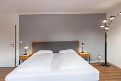 Ein Bett oder Betten in einem Zimmer der Unterkunft Ferienwohnung Am Bach 3 mit Balkon