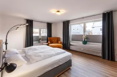 Ein Bett oder Betten in einem Zimmer der Unterkunft Ferienwohnung Am Bach 3 mit Balkon