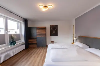 Ein Bett oder Betten in einem Zimmer der Unterkunft Ferienwohnung Am Bach 3 mit Balkon