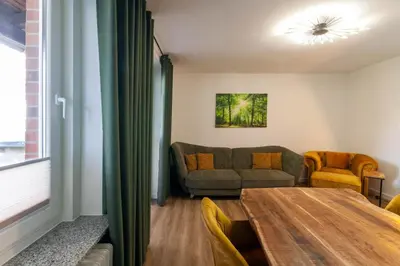 Ein Sitzbereich in der Unterkunft Ferienwohnung Am Bach 3 mit Balkon
