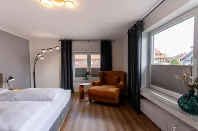 Ein Bett oder Betten in einem Zimmer der Unterkunft Ferienwohnung Am Bach 3 mit Balkon
