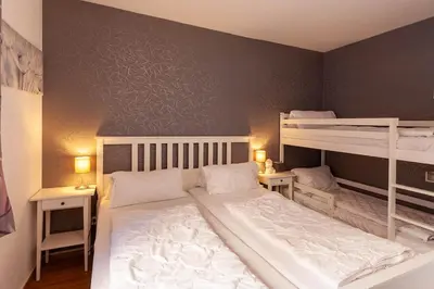 Ein Bett oder Betten in einem Zimmer der Unterkunft Ferienwohnung Wurmbergstation