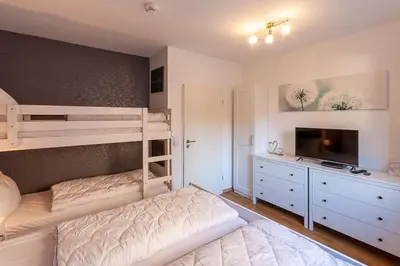 Ein Bett oder Betten in einem Zimmer der Unterkunft Ferienwohnung Wurmbergziel mit Balkon