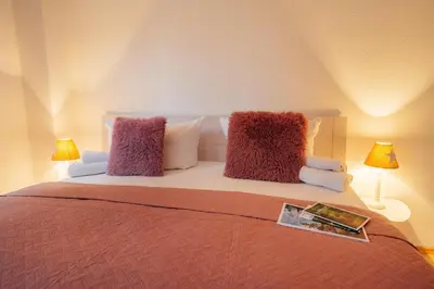 Ein Bett oder Betten in einem Zimmer der Unterkunft Ferienwohnung Adele