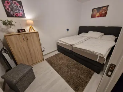 Ein Bett oder Betten in einem Zimmer der Unterkunft Apartment Gipfelstürmer im Harz mit Schwimmbad