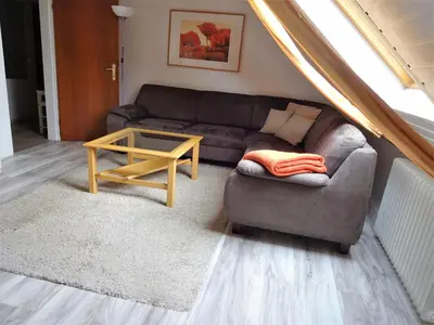 Ein Sitzbereich in der Unterkunft Ferienwohnung Schneemann