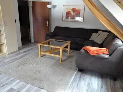 Ein Sitzbereich in der Unterkunft Ferienwohnung Schneemann