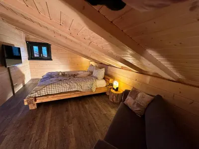 Ein Bett oder Betten in einem Zimmer der Unterkunft Harz-Blockhaus, Berg -